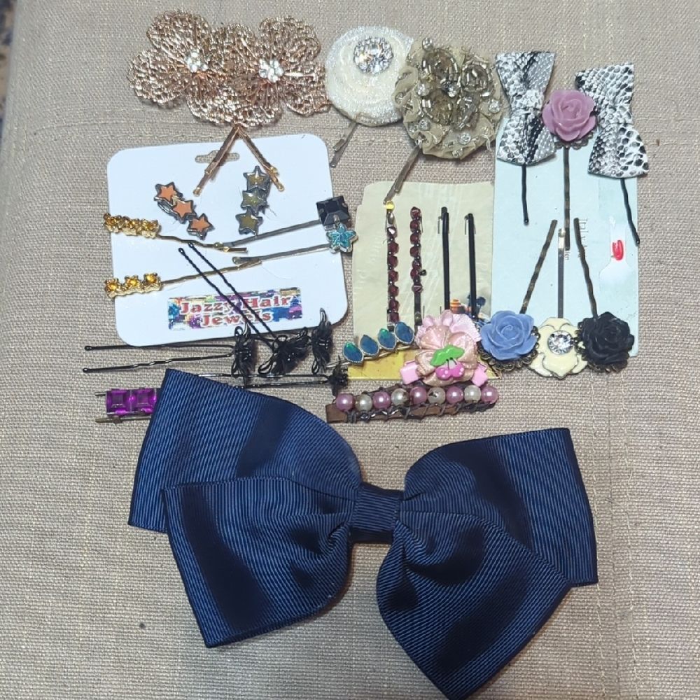 various hair accessories, including hair clips, bobby pins, and decorative bows.
